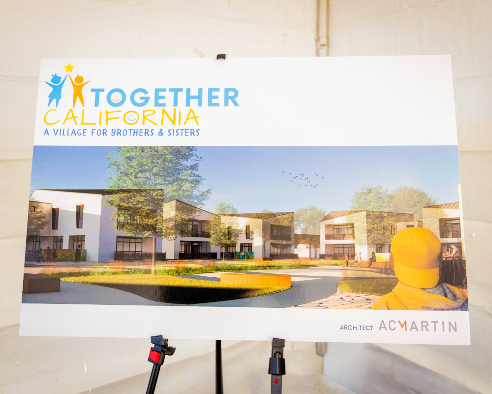 A poster showcasing a rendering of a foster care village.