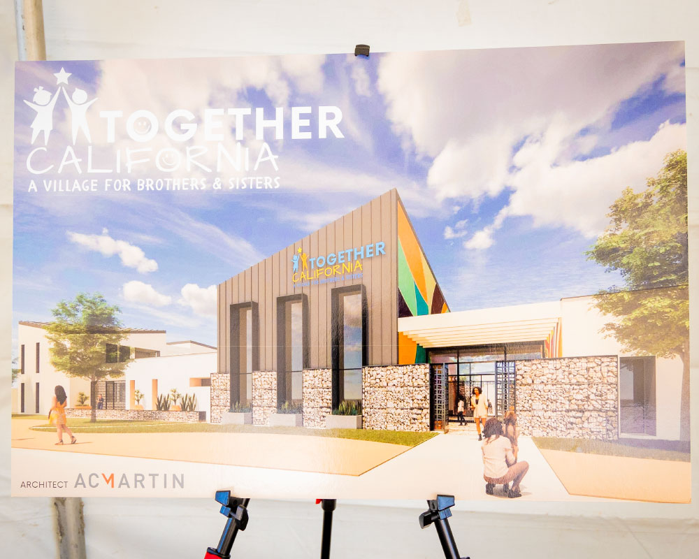 A poster showcasing a rendering of a foster care village.
