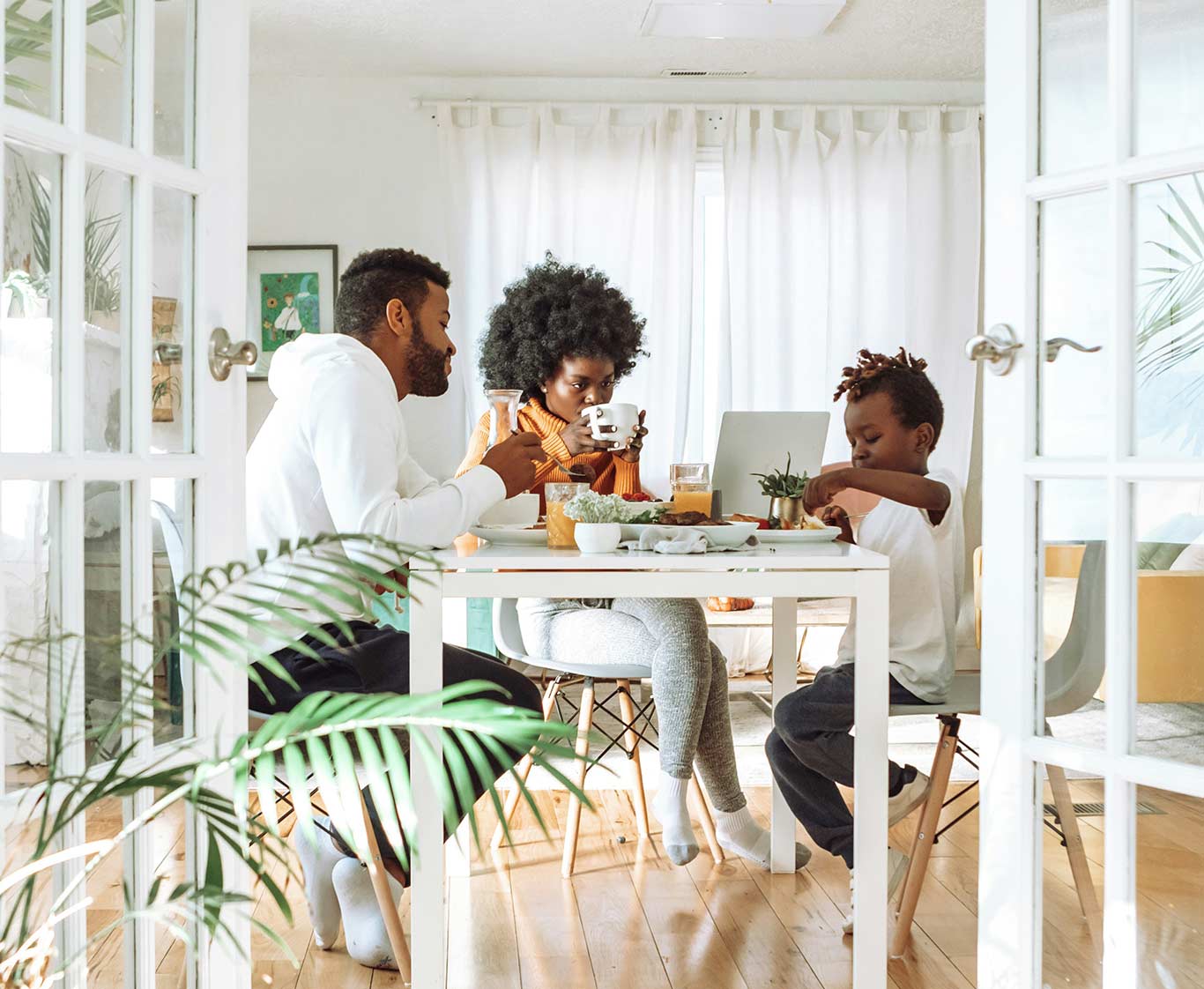 A family of three having a meal together